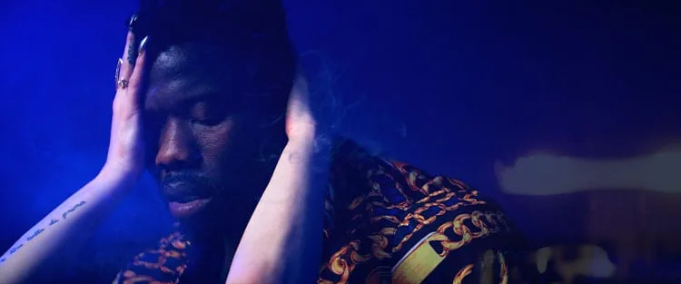 Robert Wilmote with hands around face