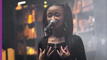 LOTYS rapping into mic