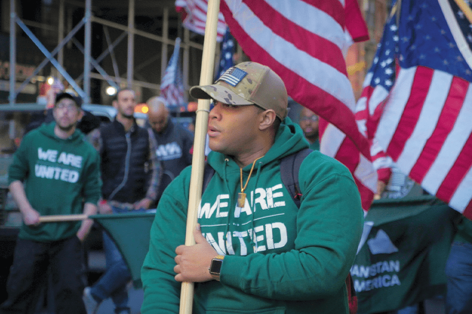 veteran holding US flag