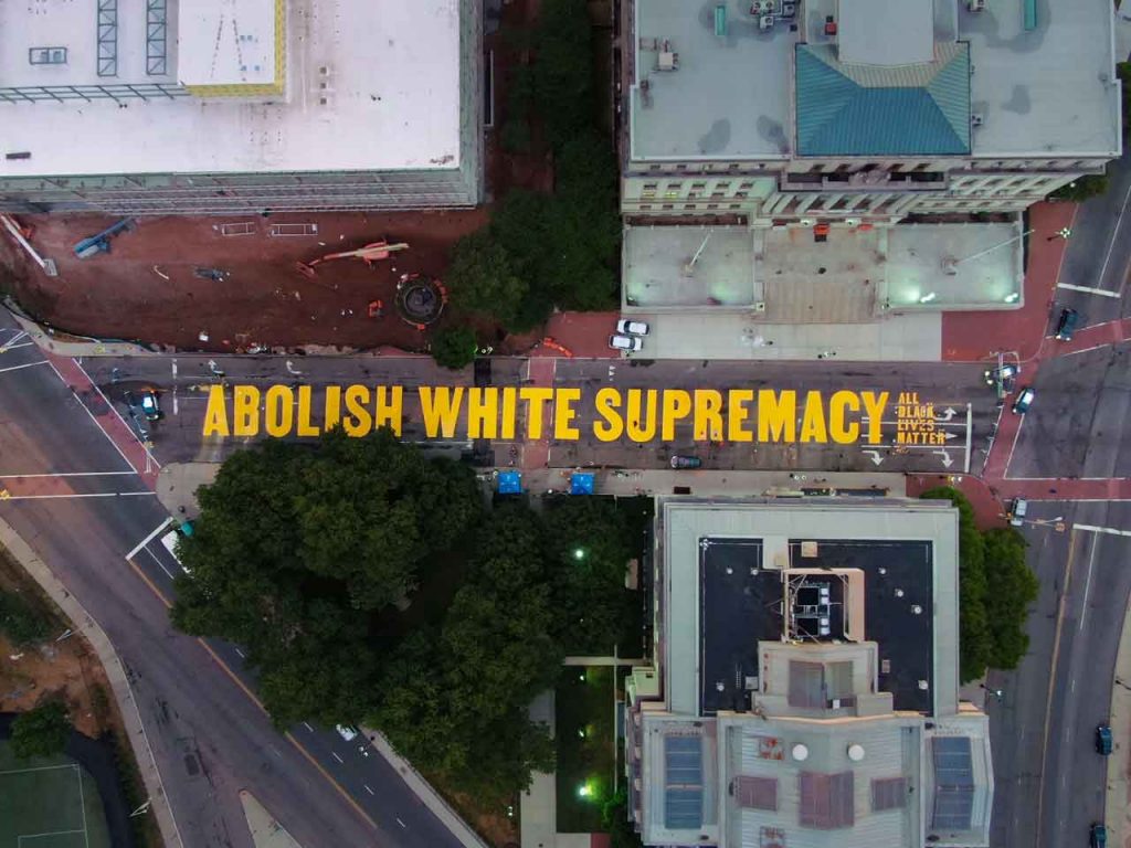 Aerial view of The new ABOLISH WHITE SUPREMACY street mural on MLK Jr. Blvd, Newark, NJ